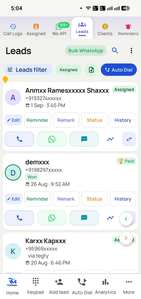 The RMDialer leads list on Android, each lead showing its assignment and status badges with Edit, Reminder, Remark, Status and History actions plus call, WhatsApp and SMS buttons.